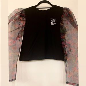 Top with contrast organza sleeves.